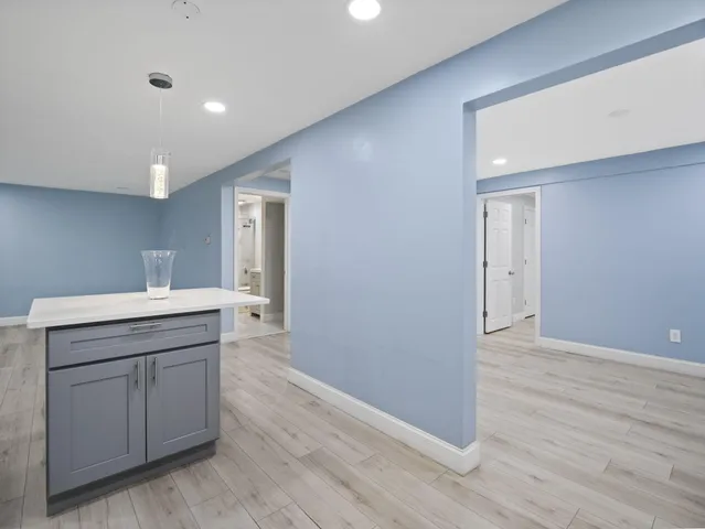 a room view with wooden floor