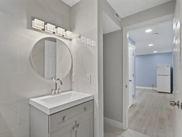 a bathroom with a sink and a mirror