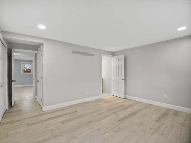 a view of wooden floor in an empty room