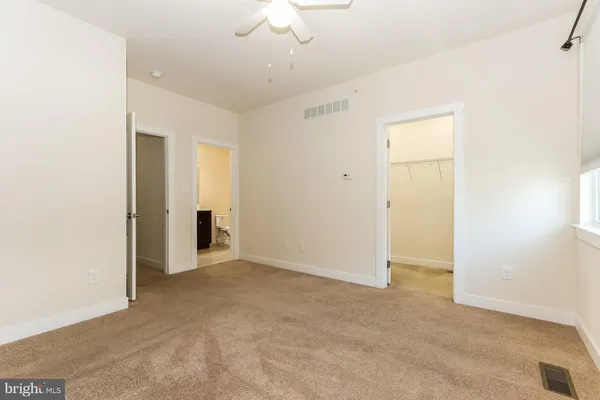 an empty room with a bathroom