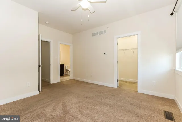 an empty room with a bathroom