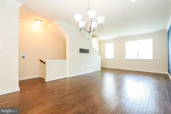 a view of a livingroom with wooden floor