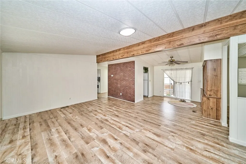 4000 Pierce Street, Unit 168 Riverside, CA 92505 - Photo 5 of 34 a view of an empty room with wooden floor and a window