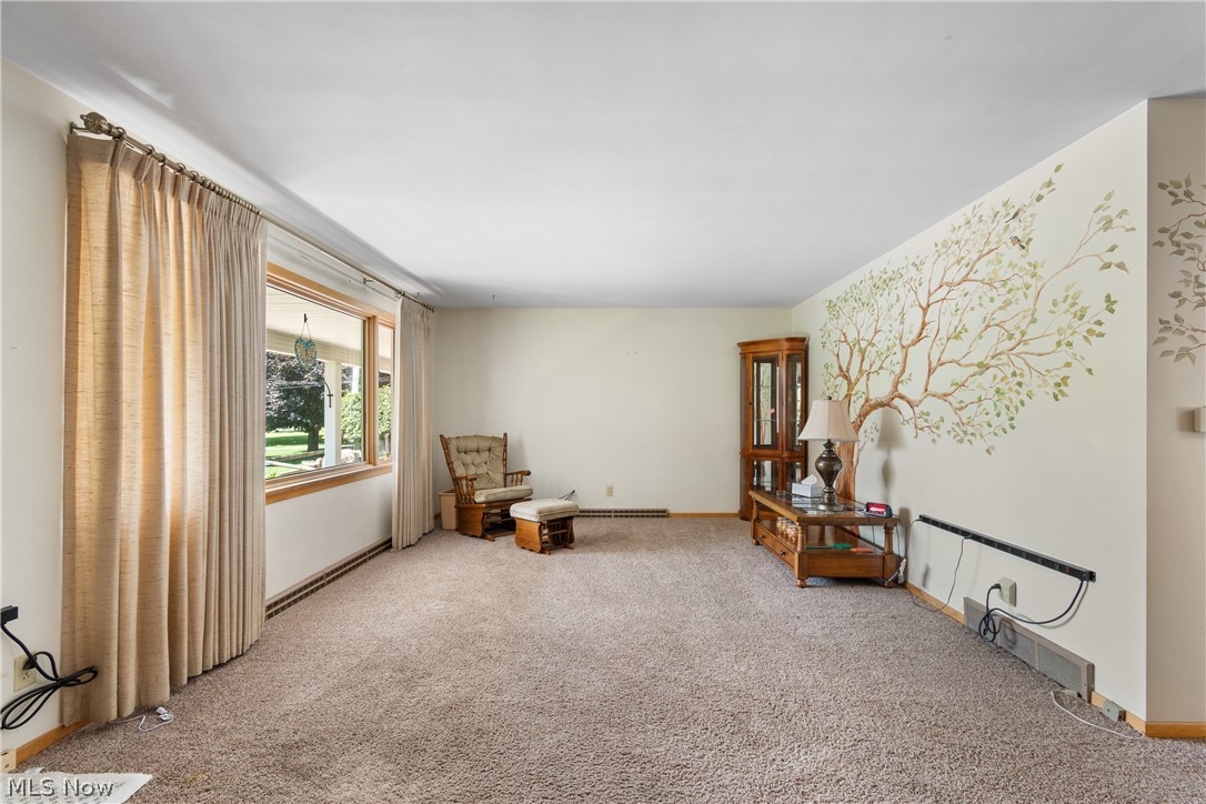 22840 Buck Road Alliance, OH 44601 - Photo 5 of 36 Unfurnished room with carpet flooring and baseboards