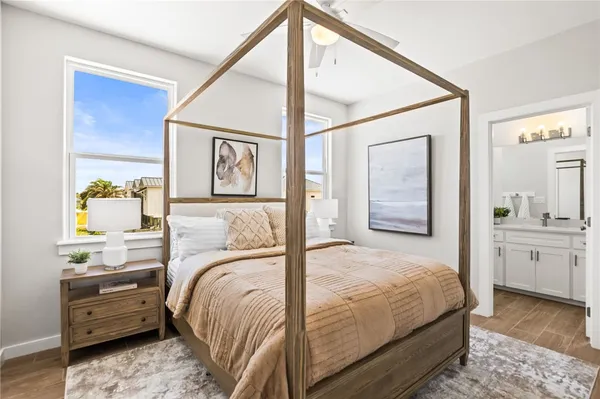a bedroom with a bed and a mirror