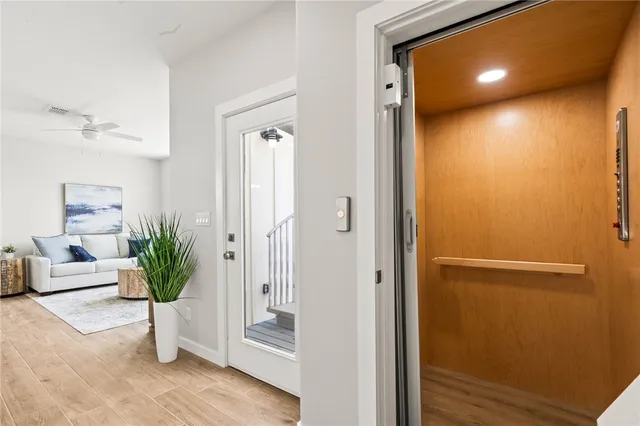 a view of kitchen with dining table wooden floor and a dining table