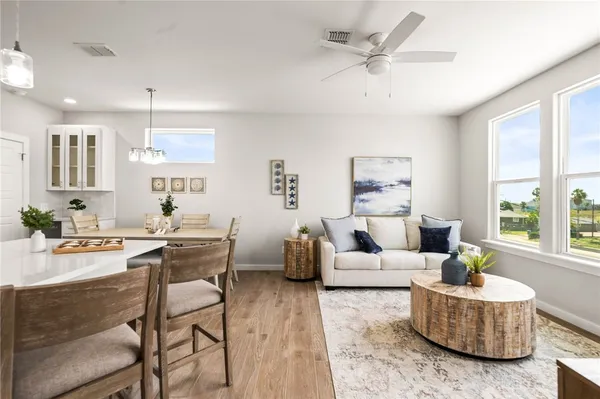 a kitchen with a sink a stove and cabinets