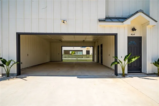a view of front door of house and yard