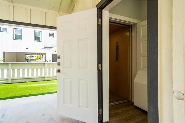 a view of kitchen with microwave and refrigerator