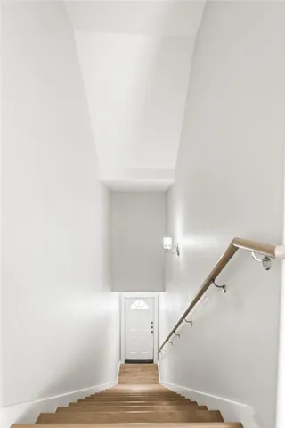 wooden floor with white walls