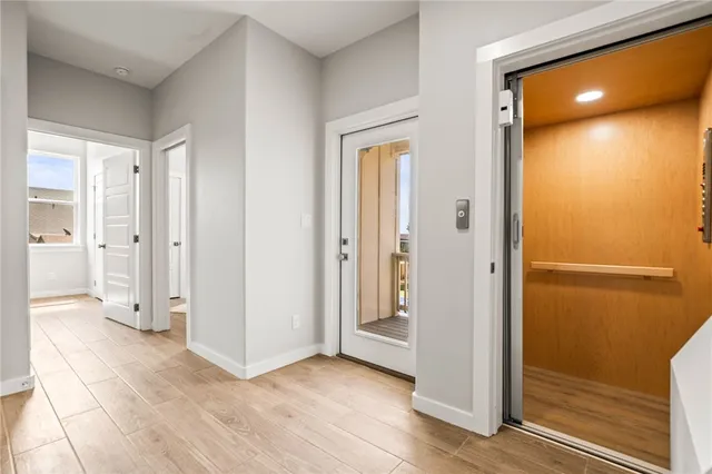a view of entryway with wooden floor