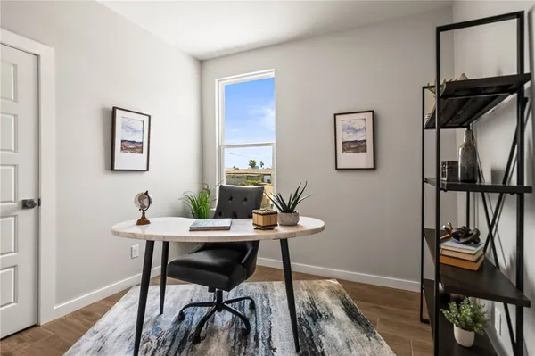 a view of a workspace with furniture