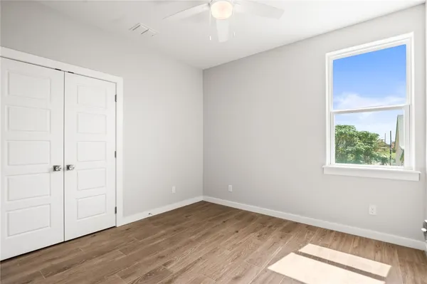 a view of a bathroom with a glass door shower