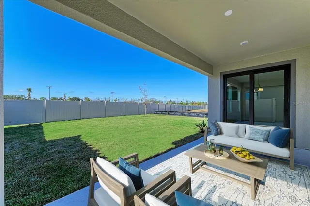 a view of a two chairs in the patio