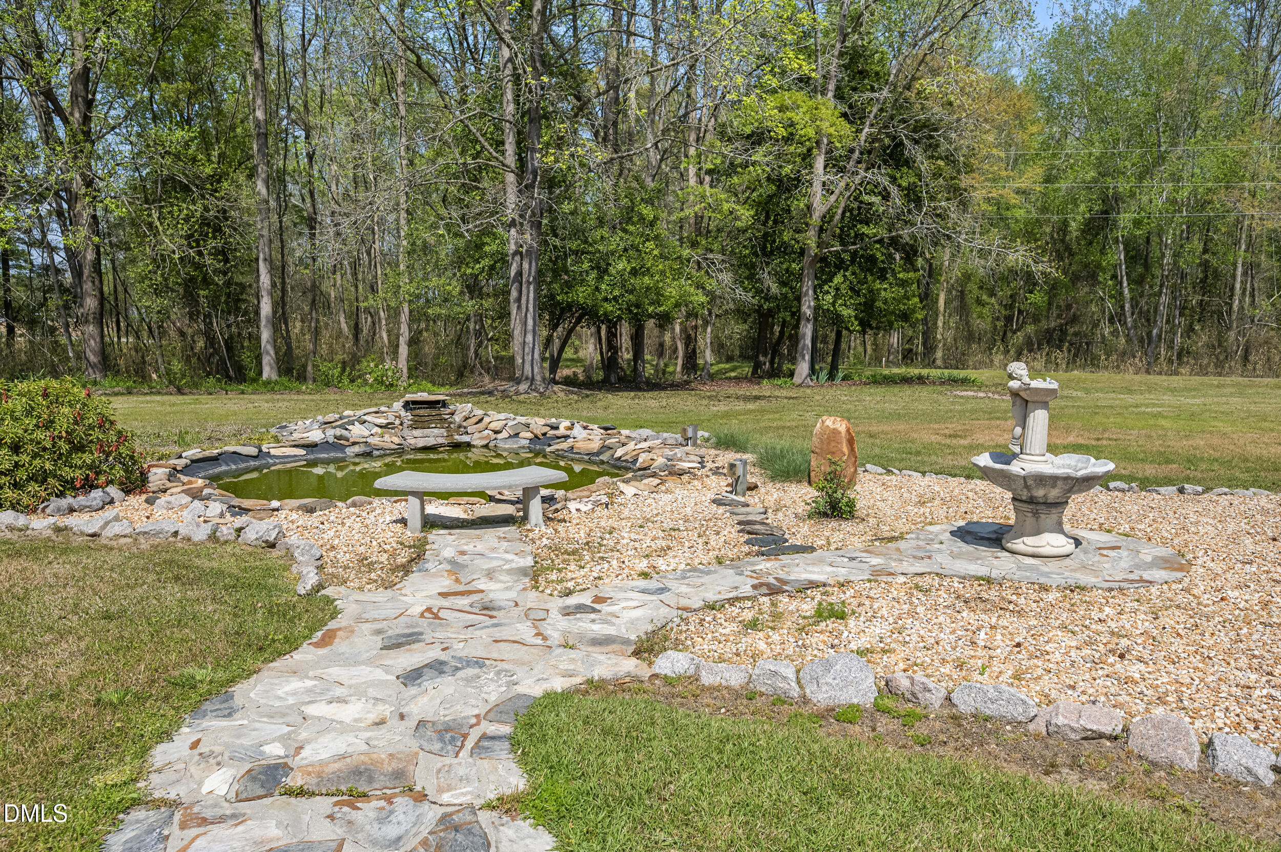 221 Pinkney Church Road Fremont, NC 27830 - Photo 5 of 36 a view of a fire pit with large trees