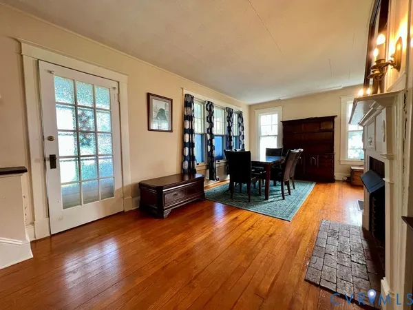 a dining room with furniture and a chandelier