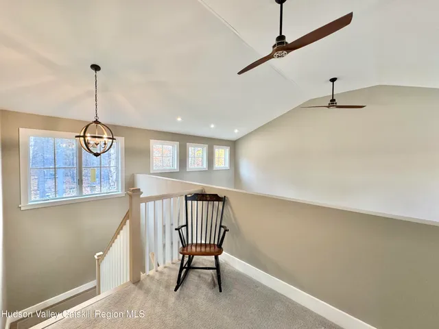 a view of a hallway with windows