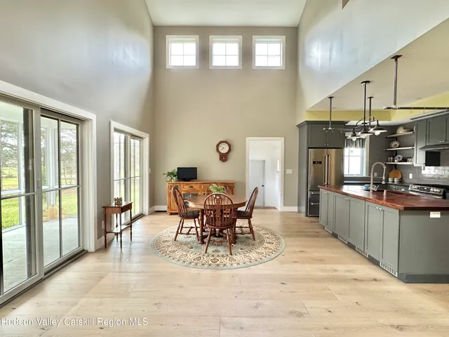 a view of a dining room with furniture window and outside view