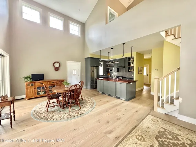 a living room with stainless steel appliances kitchen island granite countertop furniture and a kitchen view