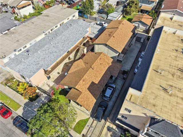 an aerial view of a house with a yard