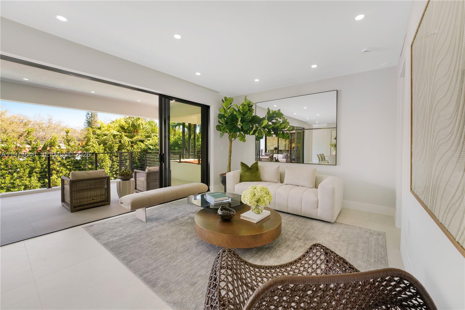 285 Woodcrest Road Key Biscayne, FL 33149 - Photo 14 of 53 a living room with furniture and a large window