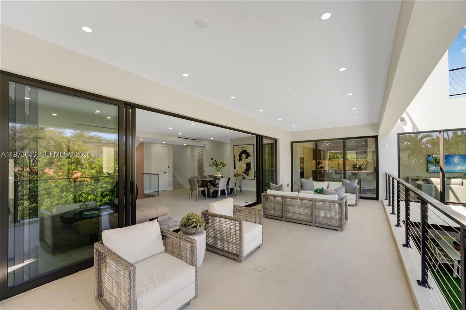 285 Woodcrest Road Key Biscayne, FL 33149 - Photo 18 of 53 a living room with fireplace furniture and a large window