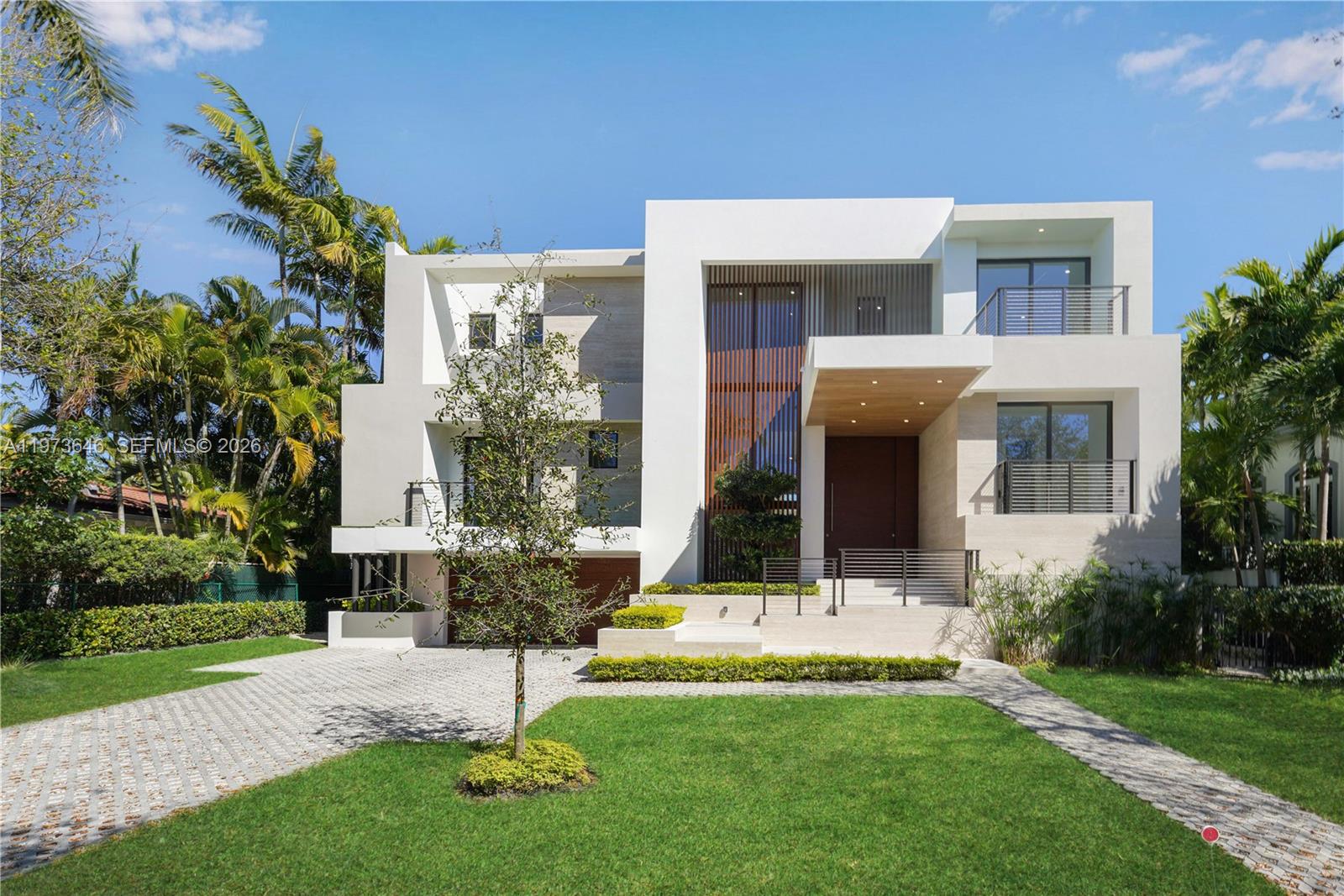285 Woodcrest Road Key Biscayne, FL 33149 - Photo 3 of 53 a front view of house with yard