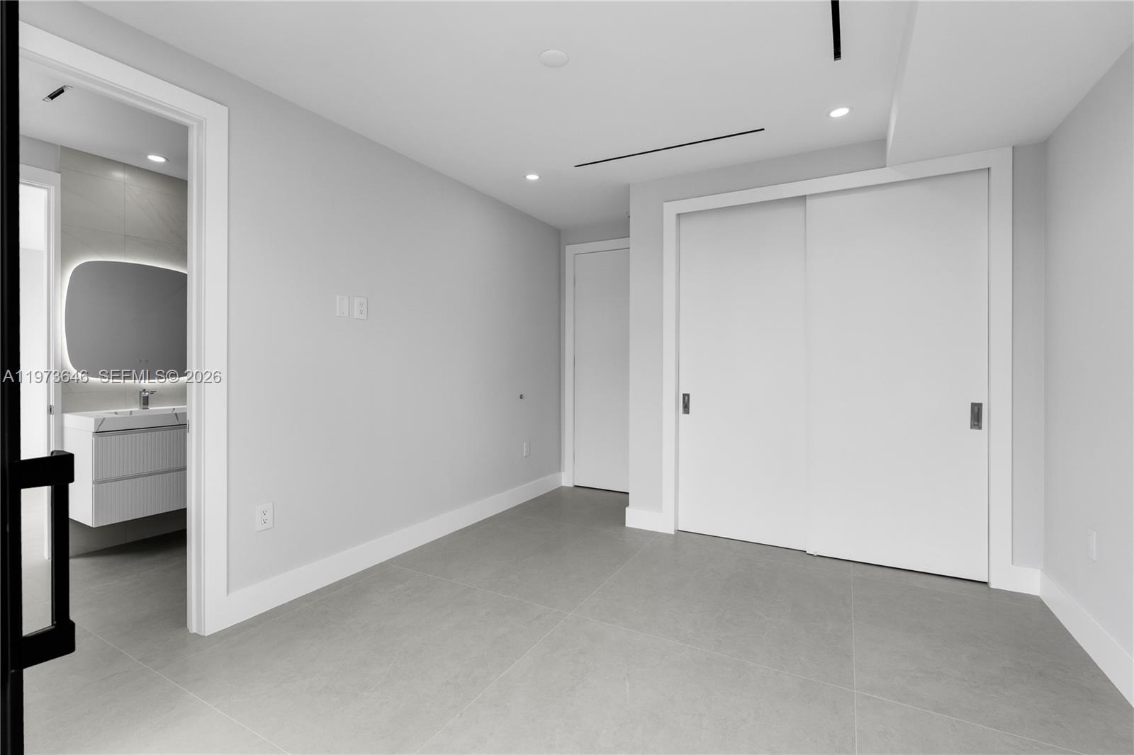 285 Woodcrest Road Key Biscayne, FL 33149 - Photo 32 of 53 a view of an empty room with a bathroom