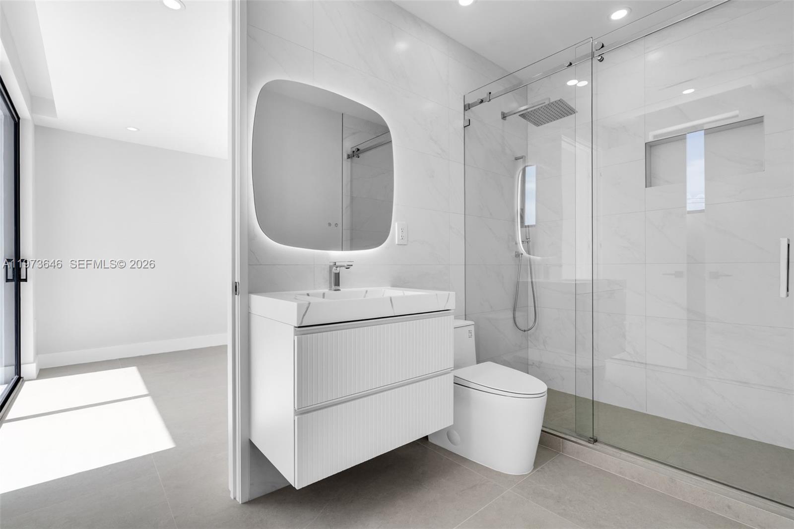 285 Woodcrest Road Key Biscayne, FL 33149 - Photo 33 of 53 a bathroom with a sink a toilet and shower