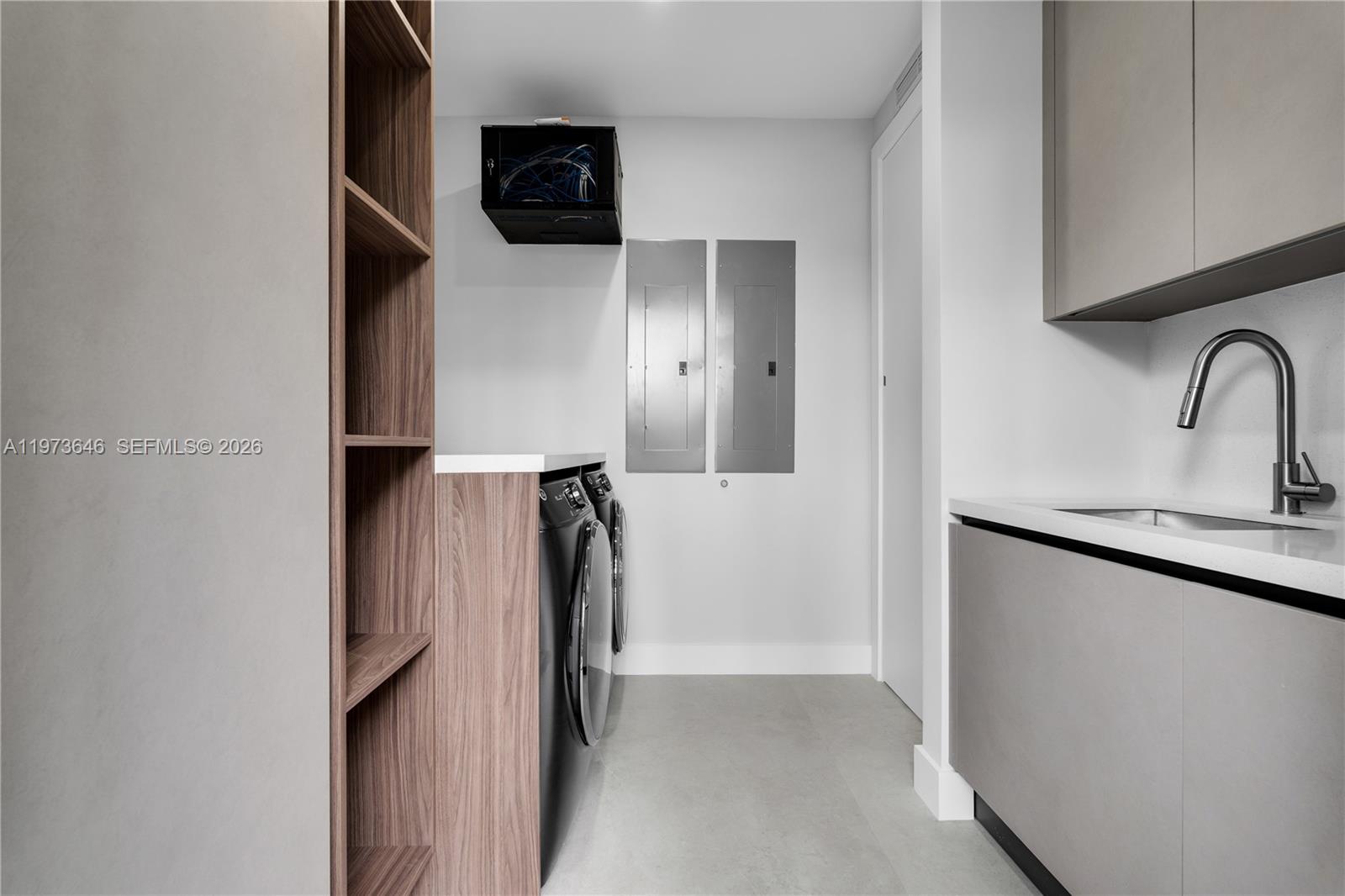 285 Woodcrest Road Key Biscayne, FL 33149 - Photo 39 of 53 a kitchen with a sink and a refrigerator