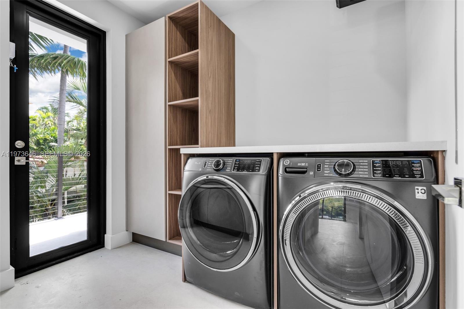 285 Woodcrest Road Key Biscayne, FL 33149 - Photo 40 of 53 a utility room with dryer and washer