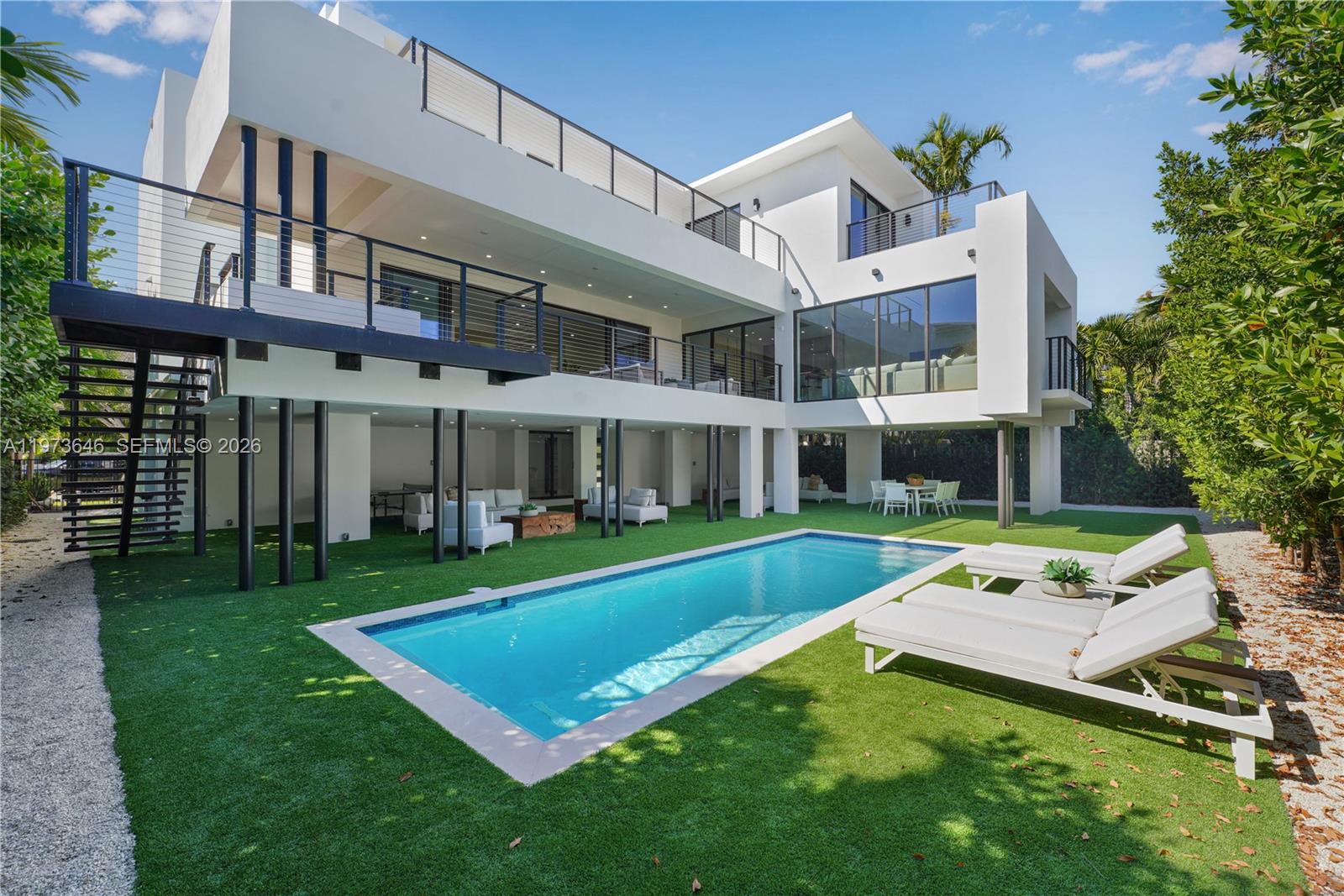 285 Woodcrest Road Key Biscayne, FL 33149 - Photo 41 of 53 front view of a house with a yard