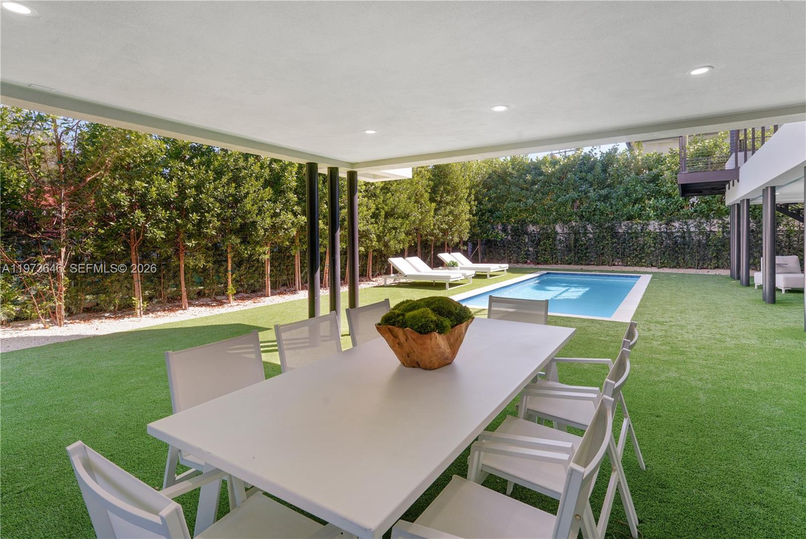 285 Woodcrest Road Key Biscayne, FL 33149 - Photo 45 of 53 a outdoor dining space with furniture and garden view