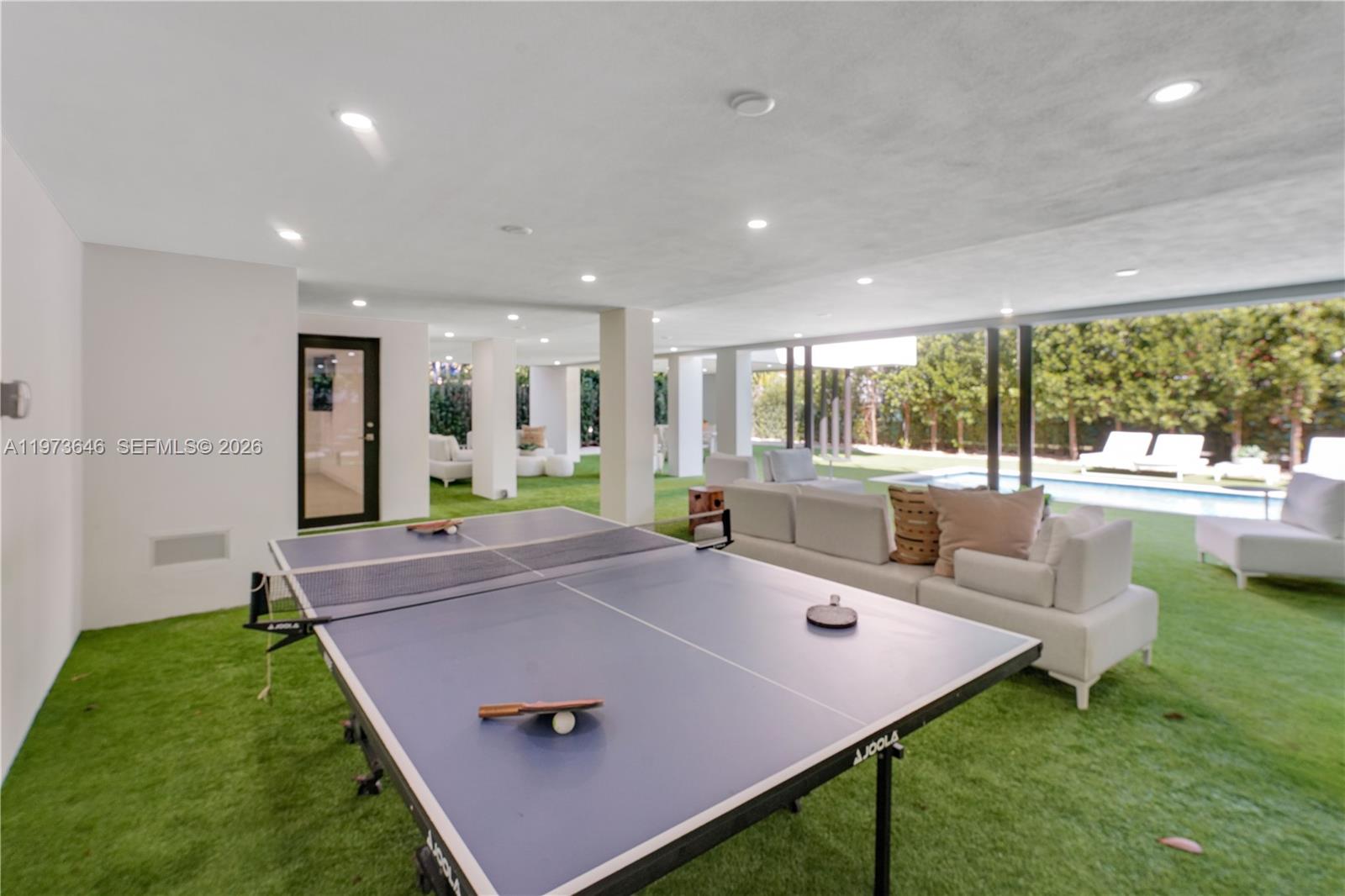 285 Woodcrest Road Key Biscayne, FL 33149 - Photo 46 of 53 a view of a living room and floor to ceiling window or kitchen