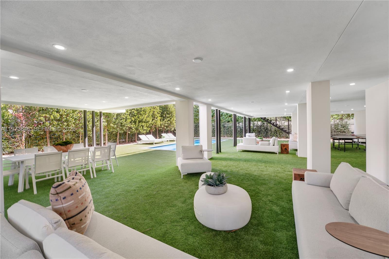 285 Woodcrest Road Key Biscayne, FL 33149 - Photo 6 of 53 a living room with furniture and a garden