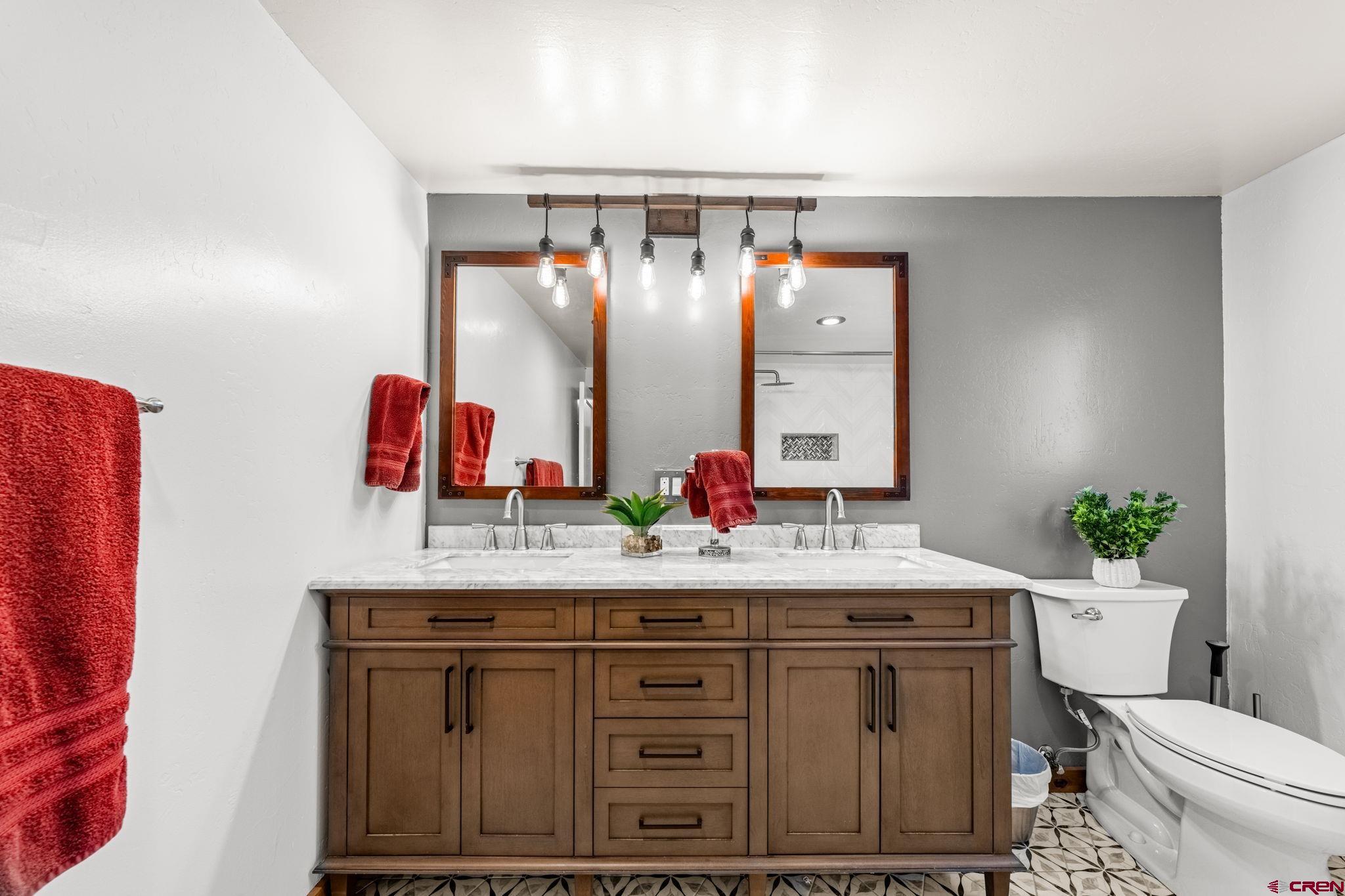 1257 Snowden Street Silverton, CO 81433 - Photo 20 of 29 a bathroom with a sink and a mirror