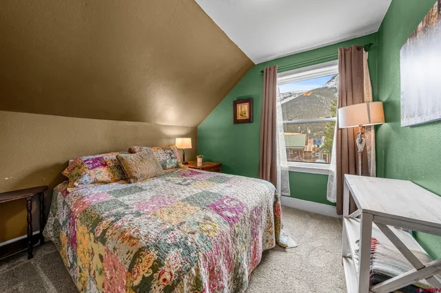 a bed room with a bed and a television