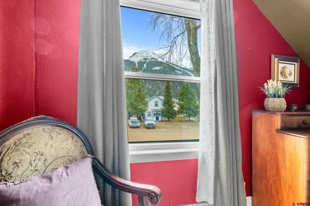 a bedroom with a bed and a lamp