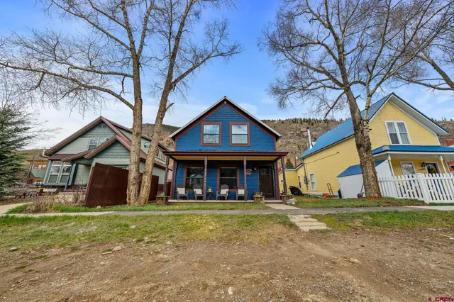 a balcony view with a large window and sitting space