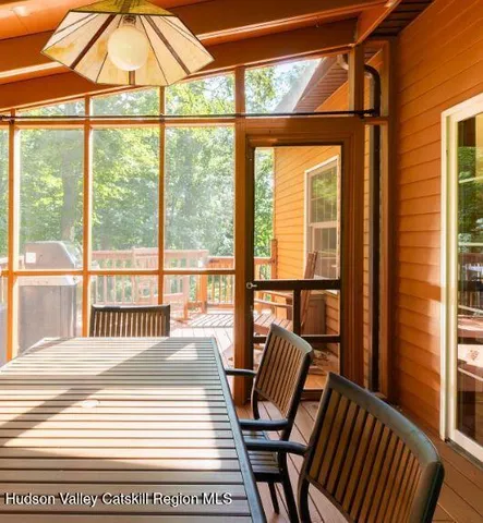 a view of a room with wooden floor and iron stairs
