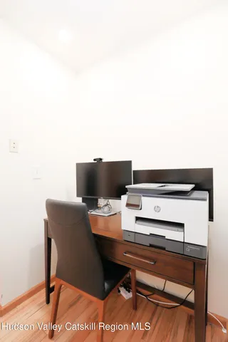 a terrace with a bench and a chair