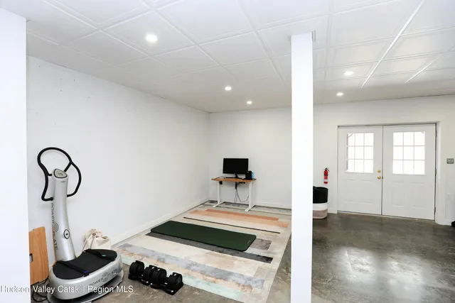 a bedroom with furniture and a window