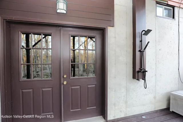 a view of an entryway with wooden floor