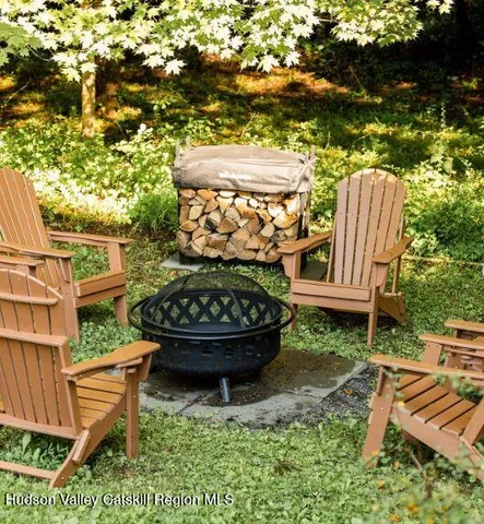 a view of a backyard with sitting area