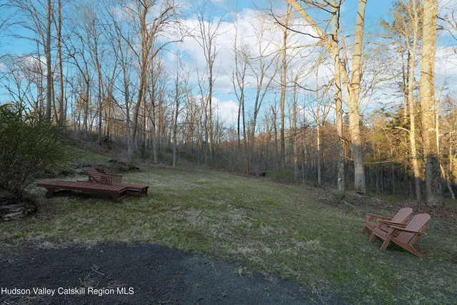 a backyard of a house with lots of green space