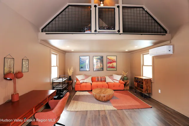 a bed room with two beds and a night stand