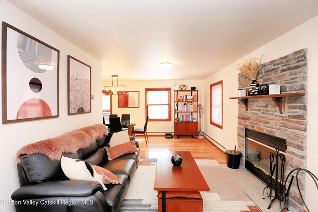 a living room with furniture fireplace and flat screen tv