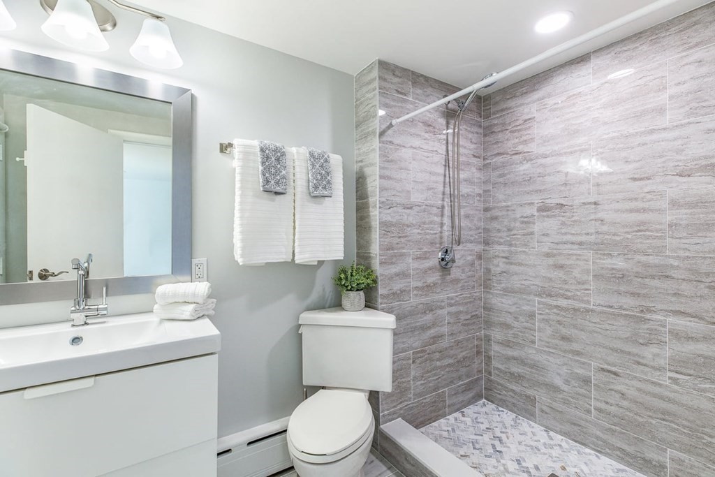 56 James Road Hanover, MA 02339 - Photo 12 of 31 a bathroom with a sink a toilet and shower
