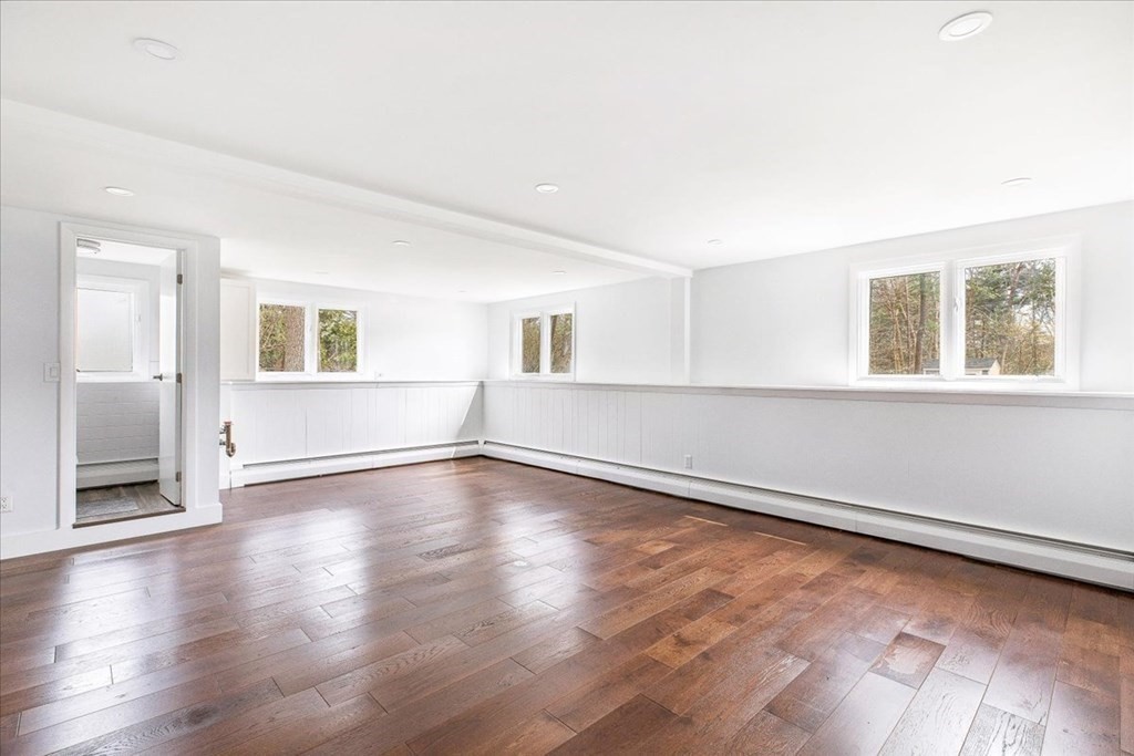 56 James Road Hanover, MA 02339 - Photo 18 of 31 an empty room with wooden floor and windows
