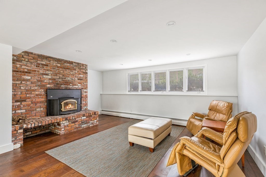 56 James Road Hanover, MA 02339 - Photo 21 of 31 a living room with furniture and a fireplace